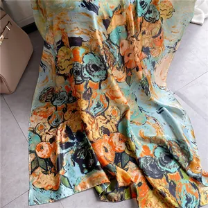 Detail of sunflower print silk scarf with satin finish on marble background