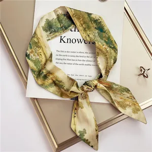Retro landscape print silk-like twilly scarf tied in a bow on a white display card