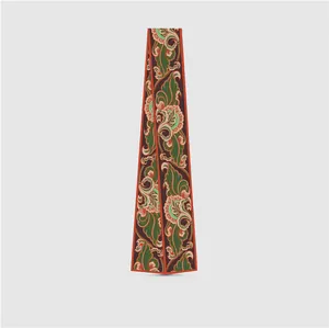 Vertical view of a floral silk twilly scarf with intricate vintage patterns