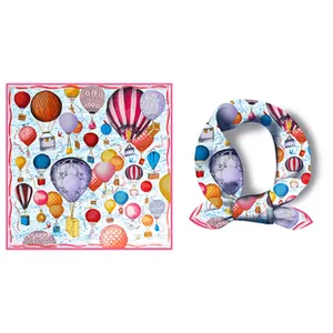Detail view of silk blend square scarf featuring colorful hot air balloon print motifs