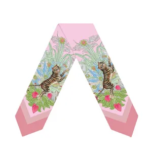 Slim pink silk scarf with jungle tiger pattern and floral print on white background