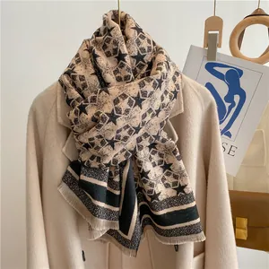 Detailed texture of thick star pattern scarf with tassels on a wool coat