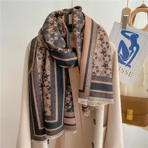 Close-up of thick khaki and black scarf with star patterns and short fringe detail