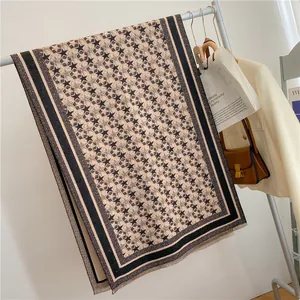 Thick star pattern winter scarf with fringe trim and striped border in beige and black