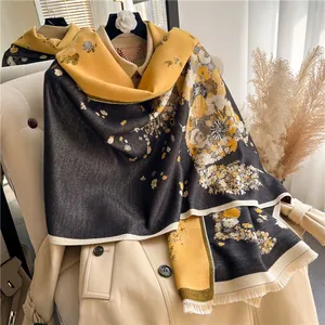 Detail shot of the ginger floral pattern and soft fringe on this heavy winter scarf