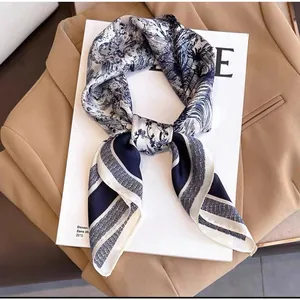 Elegant navy blue and beige silk scarf with Toile de Jouy print on a blazer jacket