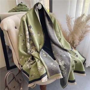 Detail of green floral pattern on double-sided imitation cashmere scarf with fringes