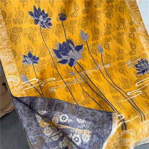 Detail of yellow shawl showing double-sided lotus flower jacquard weave and fringes
