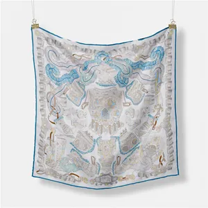 Detail of silk square scarf with blue and gold helmet print and hand-rolled edges