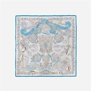 Flat lay of square silk scarf featuring blue and gold military armor heraldic motifs