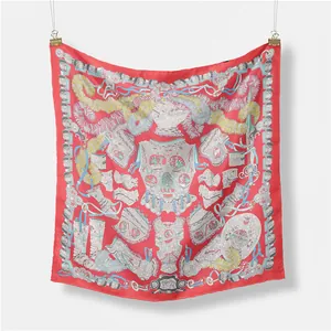 Close-up of red silk square scarf featuring vintage armor and equestrian feather prints