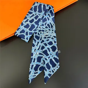 Blue geometric grid satin twilly scarf with pointed ends and a luxury finish