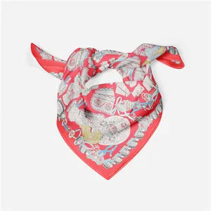 Detailed view of red ethnic silk scarf with equestrian horse print and royal patterns