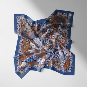 Detail of square silk scarf with ethnic pattern and smooth satin finish texture