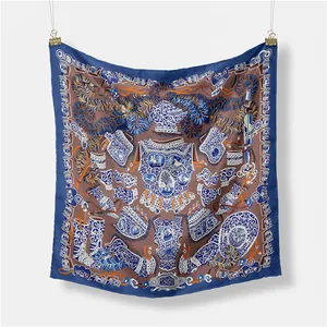 Detailed view of square satin scarf featuring ornate royal blue knight armor patterns