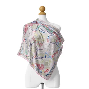 Ethnic print silk scarf with equestrian patterns shown on mannequin for professional styling