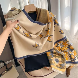 Detailed view of floral butterfly scarf showing premium fringe and sunflower pattern