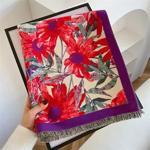 Ethnic vintage floral shawl with red blossoms and tassels for winter outdoor fashion