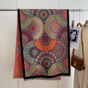 Ethnic mandala print shawl with fine fringe detail hung in a lifestyle setting