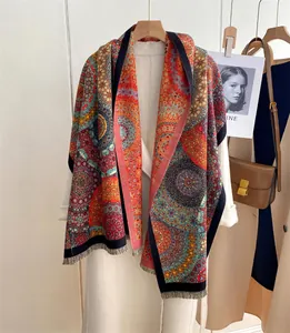 Detailed view of bohemian mandala pattern shawl with decorative fringe edges