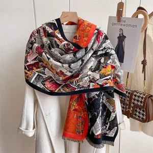 Detail of vintage newspaper print shawl with fringe on a white coat background