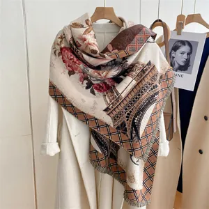 Detailed close-up of retro floral scarf with Eiffel Tower print and soft tassel trim