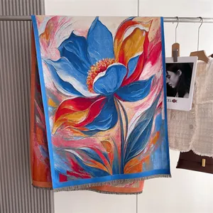 Close-up of vintage floral print pashmina shawl with tassel fringe and cashmere texture