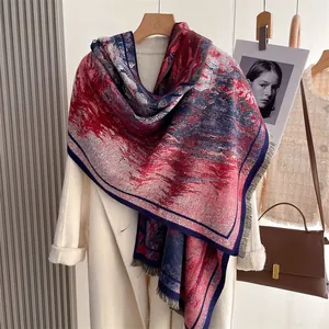 Detail of colorful vintage digital print scarf with short fringe on white coat