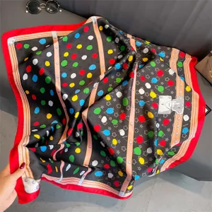 Macro detail of georgette silk scarf with colorful polka dots and studded leather belt print