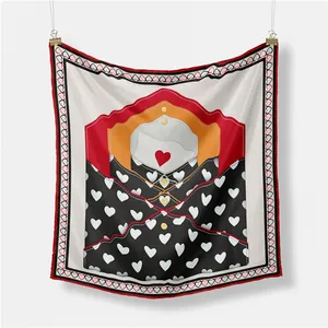 Detail view of square silk scarf with envelope heart patterns hung on white wall