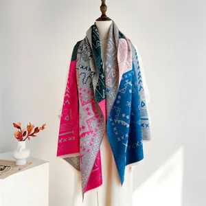 Detailed view of bohemian geometric pattern shawl with colorful patchwork and soft fringe