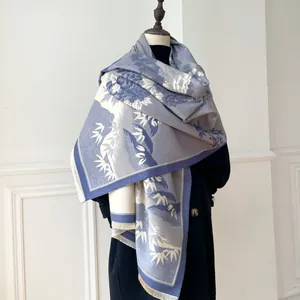 Detailed view of winter scarf with Chinese style floral jacquard and soft fringe edges
