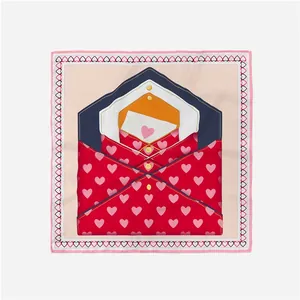 Macro shot of 53cm square silk scarf featuring red heart patterns and envelope design