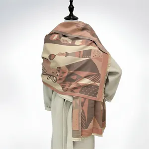 Detail of warm color block scarf with abstract art patterns and fringe on beige wool coat