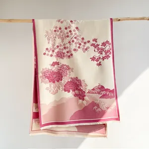 Detail of floral cashmere-like shawl with Chinese mountain art hanging on a branch