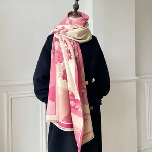 Detail of pink floral jacquard scarf with Chinese landscape pattern and soft tassels