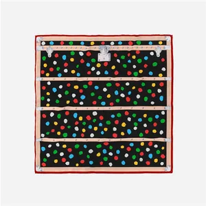 Detailed macro shot of vintage trunk pattern silk scarf with colorful polka dots