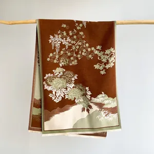 Detail of winter cashmere shawl featuring vintage Chinese floral patterns and soft fringes