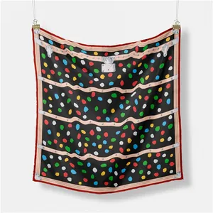 Close-up of square scarf with vibrant colorful polka dots and vintage luggage strap design