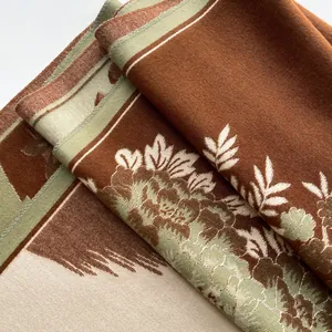 Close-up of winter cashmere-like shawl featuring vintage floral jacquard knit details