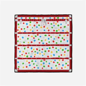 Detailed close-up of a 53cm square silk scarf with vibrant colorful polka dots and hardware print
