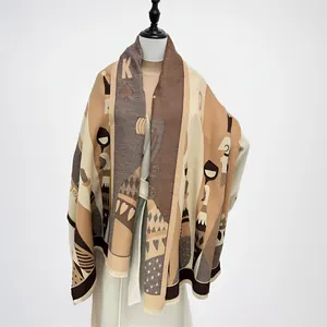 Detail of playing card pattern on thick warm scarf with tassel edge in khaki and brown