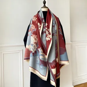 Detail of winter pashmina shawl showing Chinese floral pattern and tassel trim