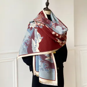 Detail of burgundy and blue floral pashmina with bamboo leaves and soft tassels