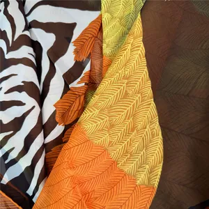 Macro shot of French georgette scarf fabric showing zebra and feather print details