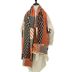 Houndstooth pattern thick winter scarf with orange chain print and fringe details