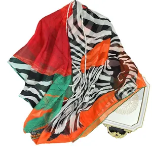 Zebra and palm leaf print georgette silk scarf with vibrant orange geometric accents