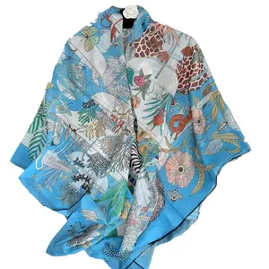 Lightweight blue floral silk scarf featuring giraffes and tropical prints for women