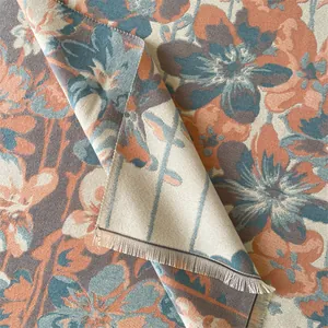 Detail shot of vintage cashmere shawl fringe and fine woven floral textile texture