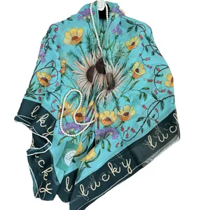 Sky blue sunflower print silk scarf with lucky text and green border for summer